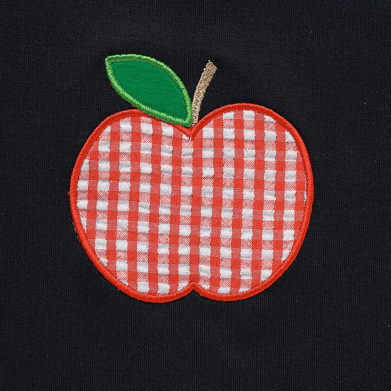 Red and white checkered apple patch on a black background