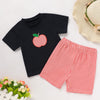 Black t-shirt with red checkered apple design and red checkered shorts on a white background.