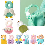 Set of colorful baby toys with animal designs on a green background