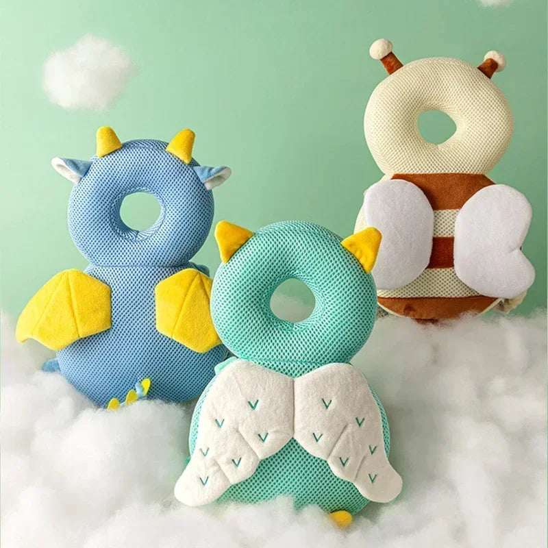 Three soft toys shaped like animals on a cloud with a light green background