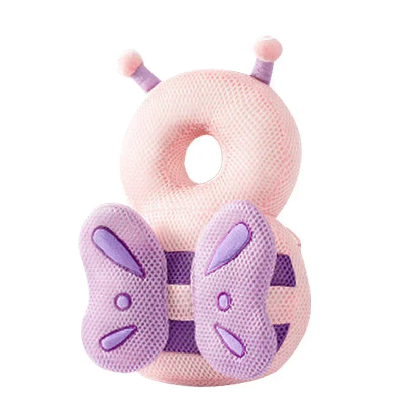 Pink and purple caterpillar-shaped pillow on a white background