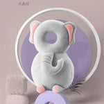 Gray elephant-shaped product on a purple stand with a circular light in the background