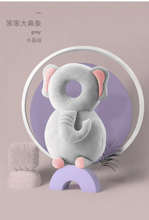 Gray elephant-shaped product on a purple stand with a circular light in the background