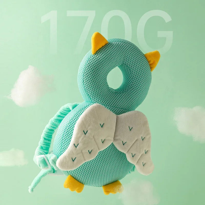 Teal owl plush toy with yellow accents on a light green background