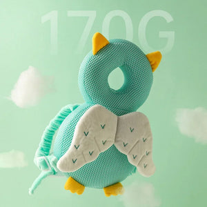 Teal owl plush toy with yellow accents on a light green background