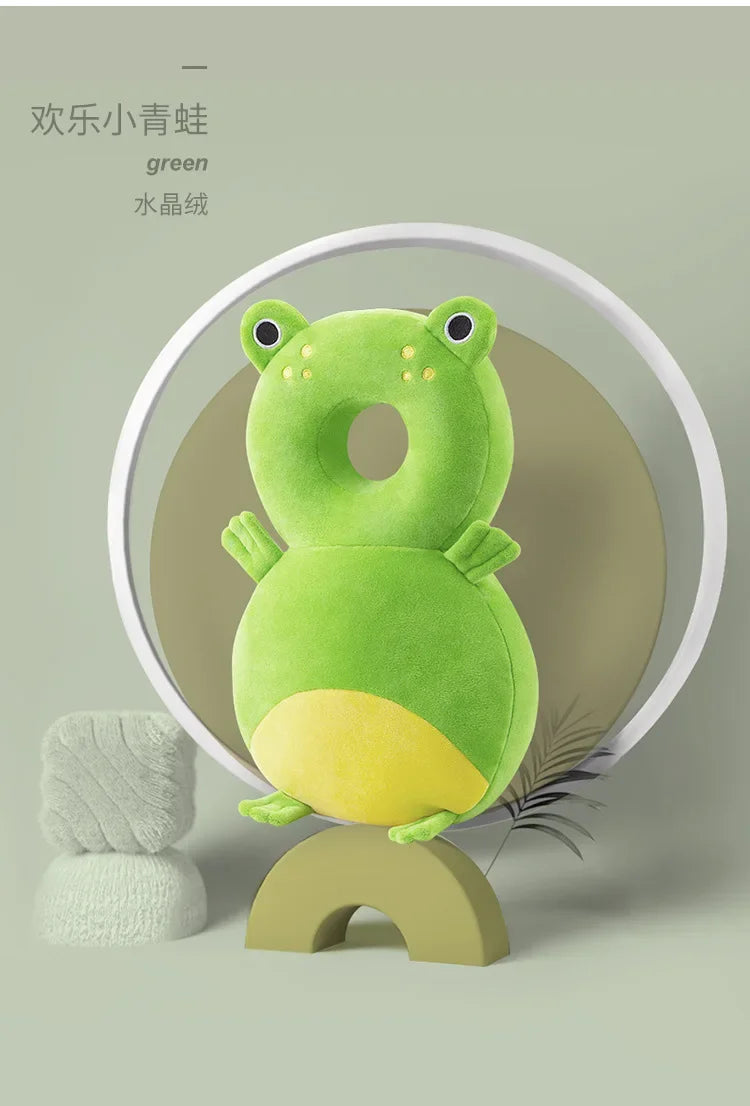 Green frog-shaped pillow on a stand with a plain background