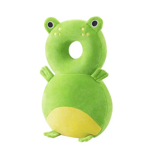 Green frog-shaped pillow on a white background