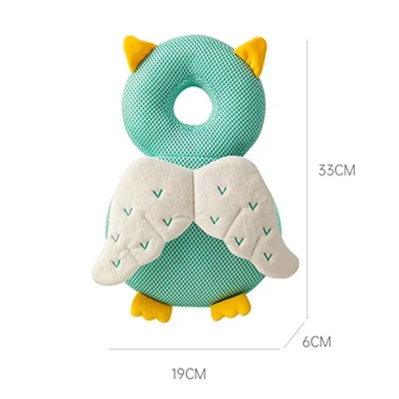 Owl-shaped pillow with green and yellow colors on a white background