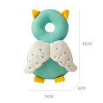 Owl-shaped pillow with green and yellow colors on a white background