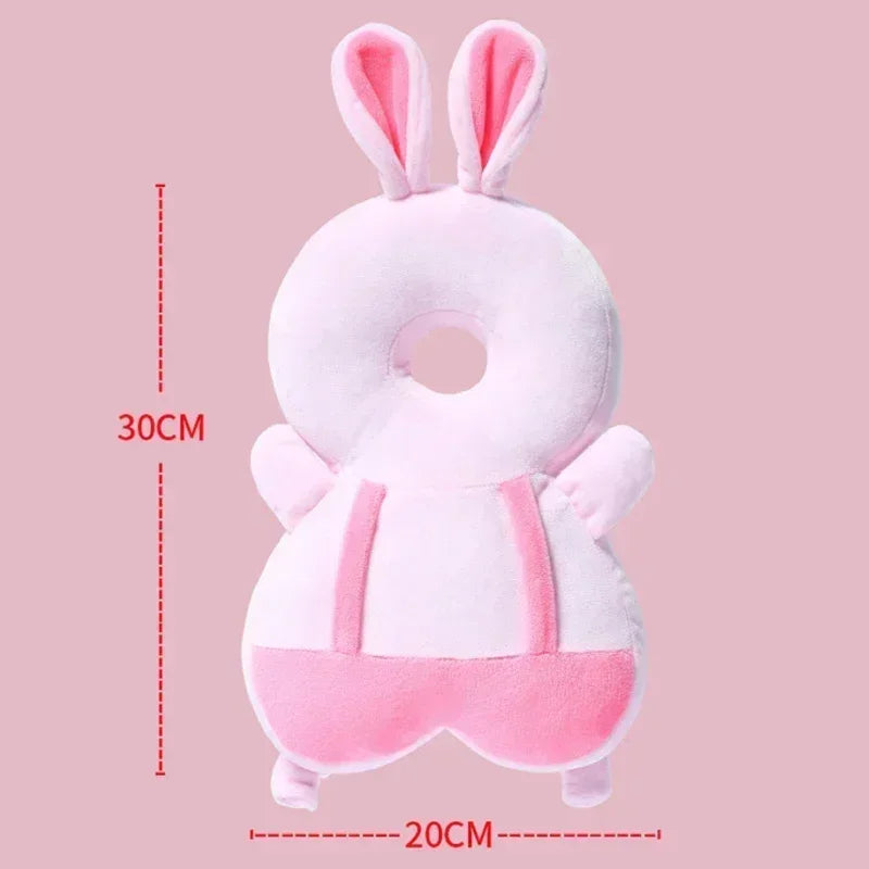 Plush toy with bunny ears and measurements on a pink background