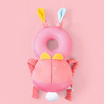 Pink baby head support with bunny ears on a pink background