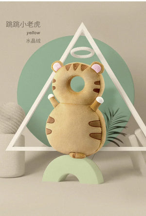 Plush toy tiger on a stand with a geometric background