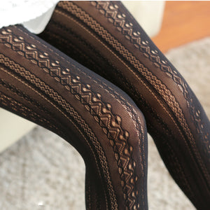 Close-up of brown patterned fabric on a neutral background