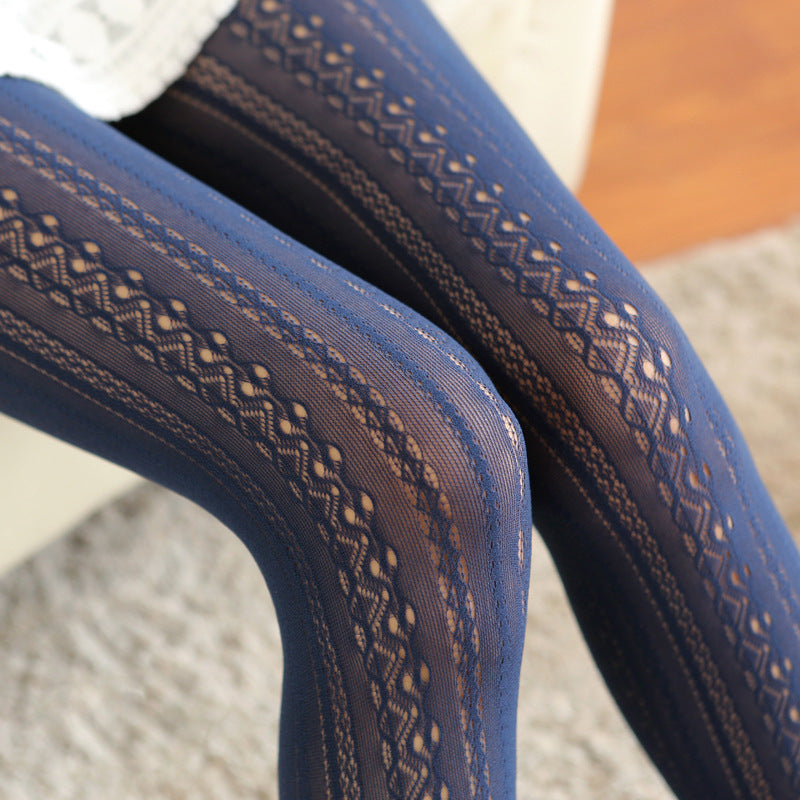 Close-up of blue fabric with a subtle pattern on a textured surface