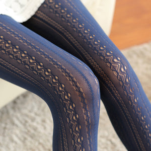 Close-up of blue fabric with a subtle pattern on a textured surface