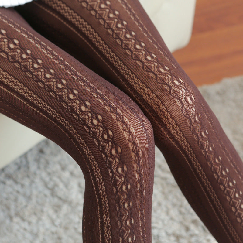 Brown patterned leggings on a chair with a blurred background