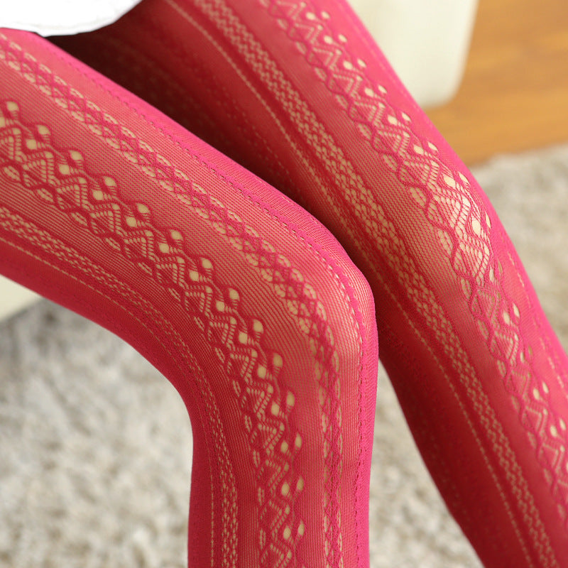 Close-up of pink lace tights with a blurred background