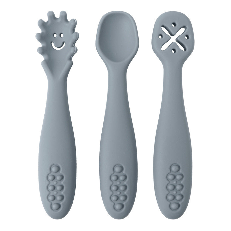 Three gray baby utensils with different designs on a white background