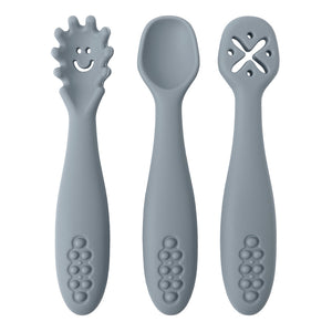 Three gray baby utensils with different designs on a white background