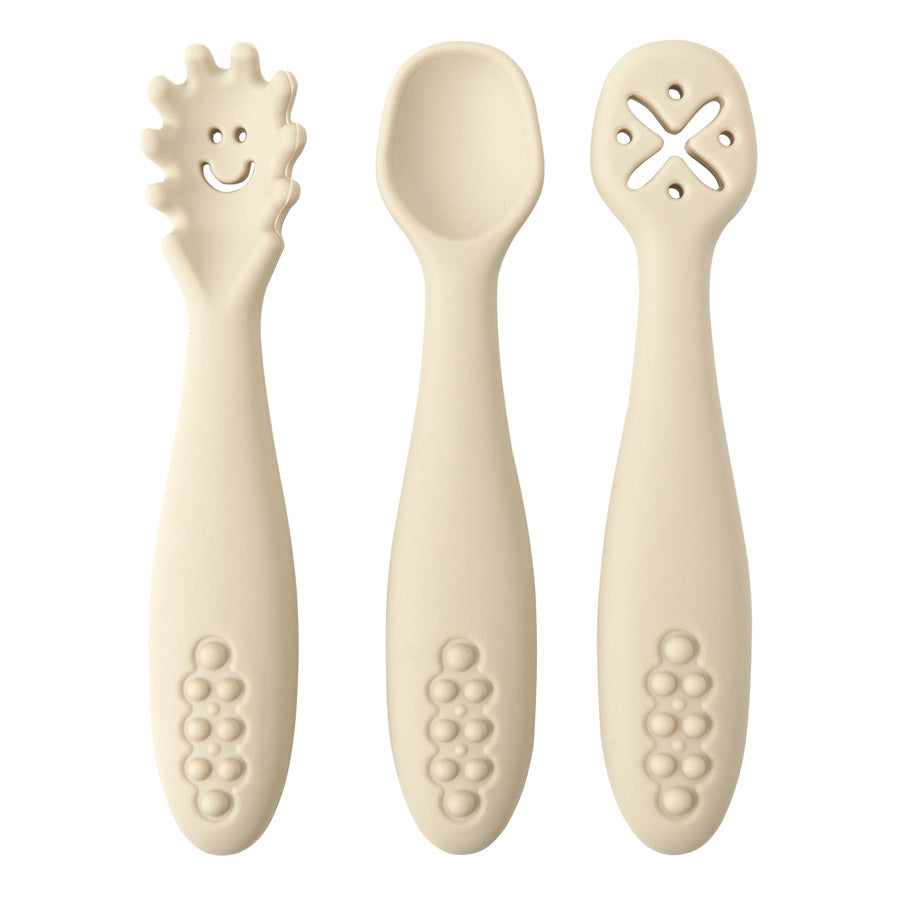 Three baby utensils with unique designs on a white background