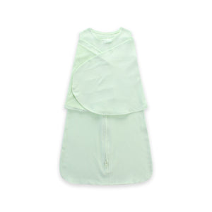 Light green sleeveless dress with layered design on a white background