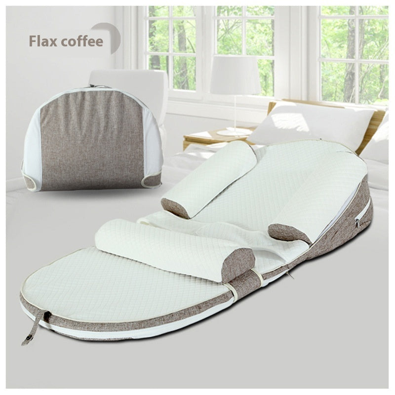 White and gray foot massager on a light surface with a window in the background