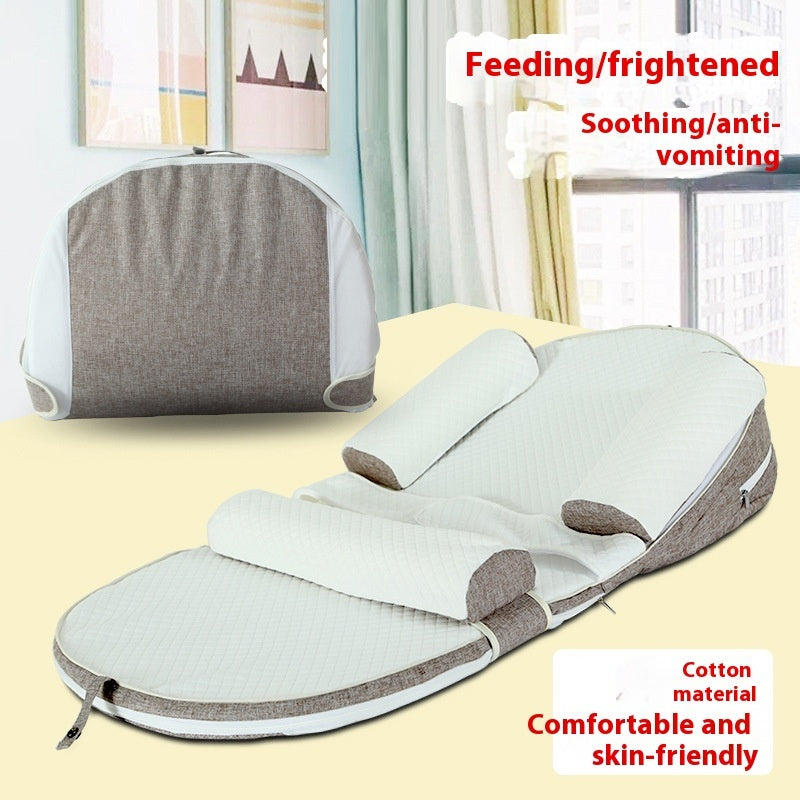 Baby wrap with text indicating its use for feeding, comfort, and anti-vomiting on a neutral background.