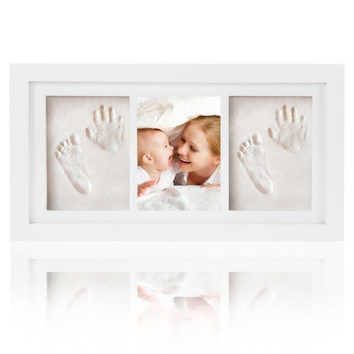 White photo frame with baby hand and footprints embedded, featuring a mother and baby.