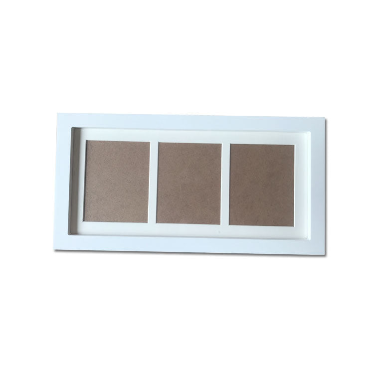 White picture frame with three brown panels on a white background