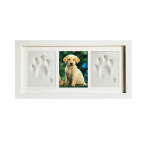 White frame with two clay impression slots and a photo of a puppy inside.