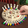 Wooden peg game with colorful pegs on a wooden table