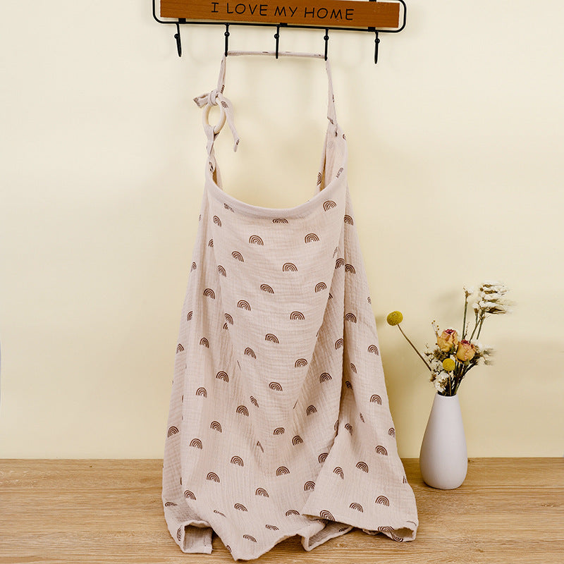 Beige dress with rainbow pattern on a mannequin against a yellow wall with a 'I LOVE MY HOME' sign.