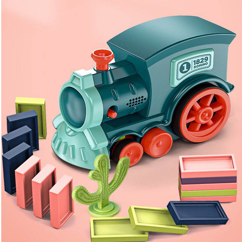 Toy train set with colorful blocks on a pink background