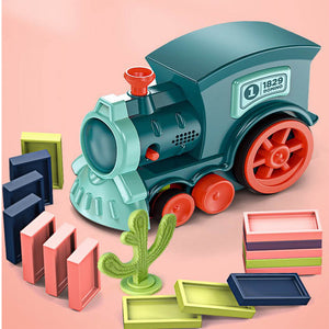 Toy train set with colorful blocks on a pink background