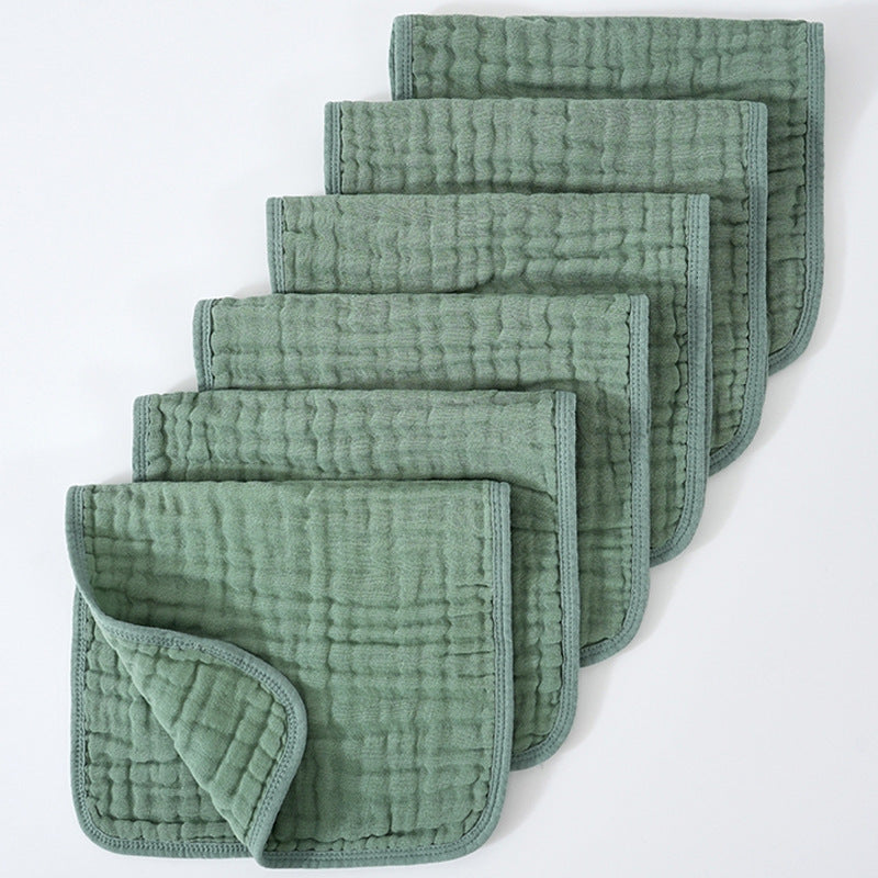 Set of green textured cloths on a white background