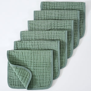 Set of green textured cloths on a white background
