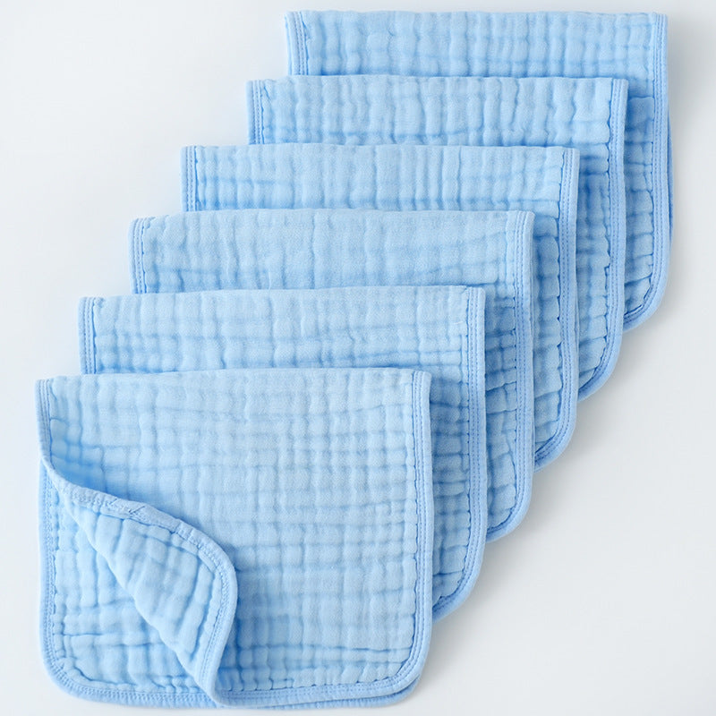 Set of light blue baby burp cloths on a white background