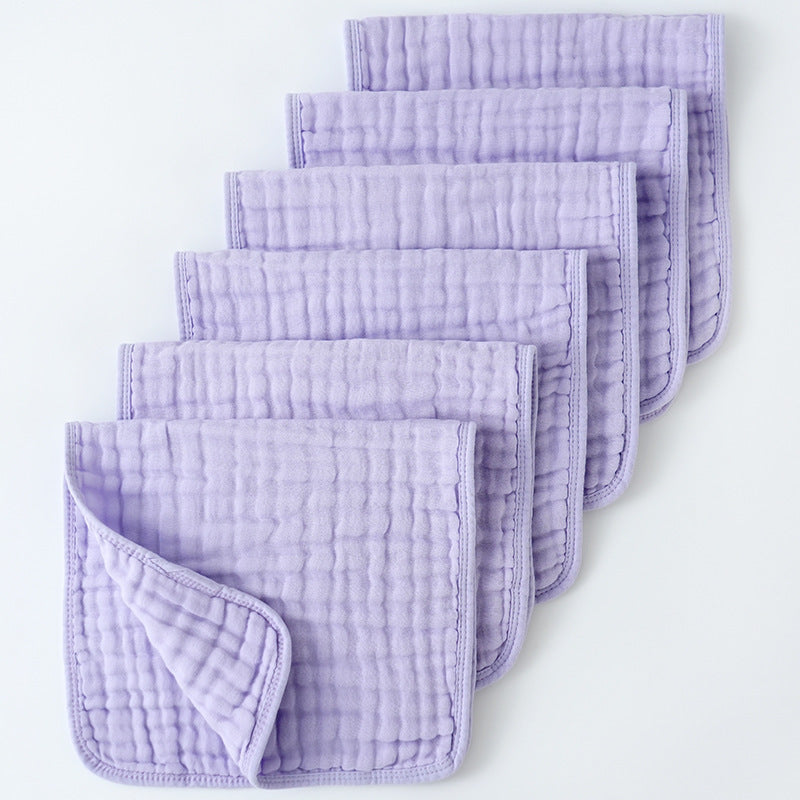 Set of purple textured cloths on a white background