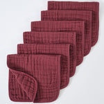 Set of red quilted baby blankets on a white background