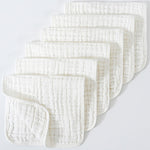 Set of white textured cloths on a light gray background