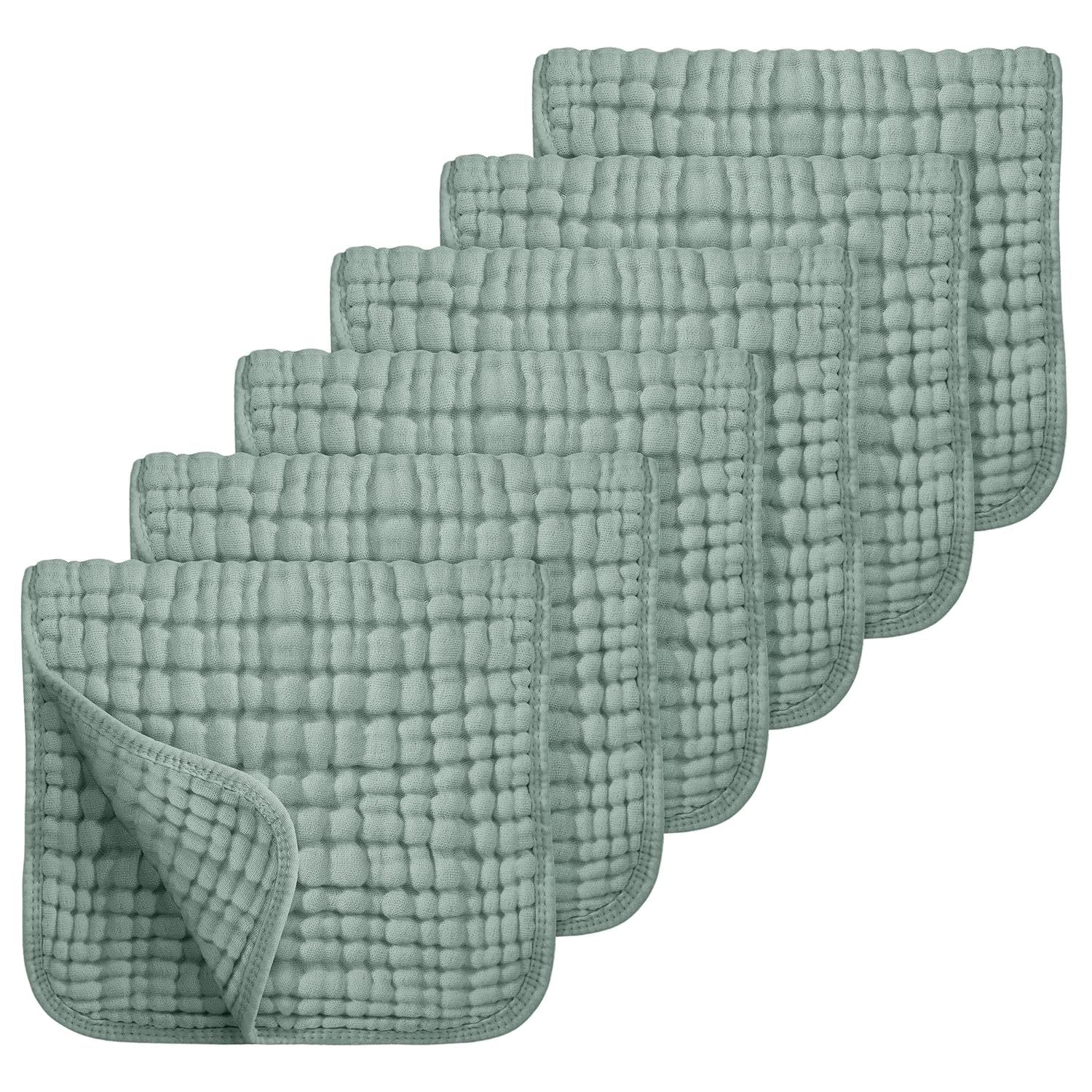 Set of six green textured cloths on a white background