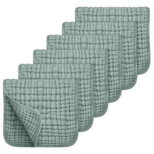 Set of six green textured cloths on a white background