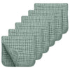 Set of six green textured cloths on a white background