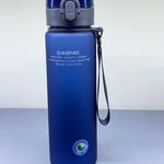 Blue water bottle with gray lid and strap on a white background