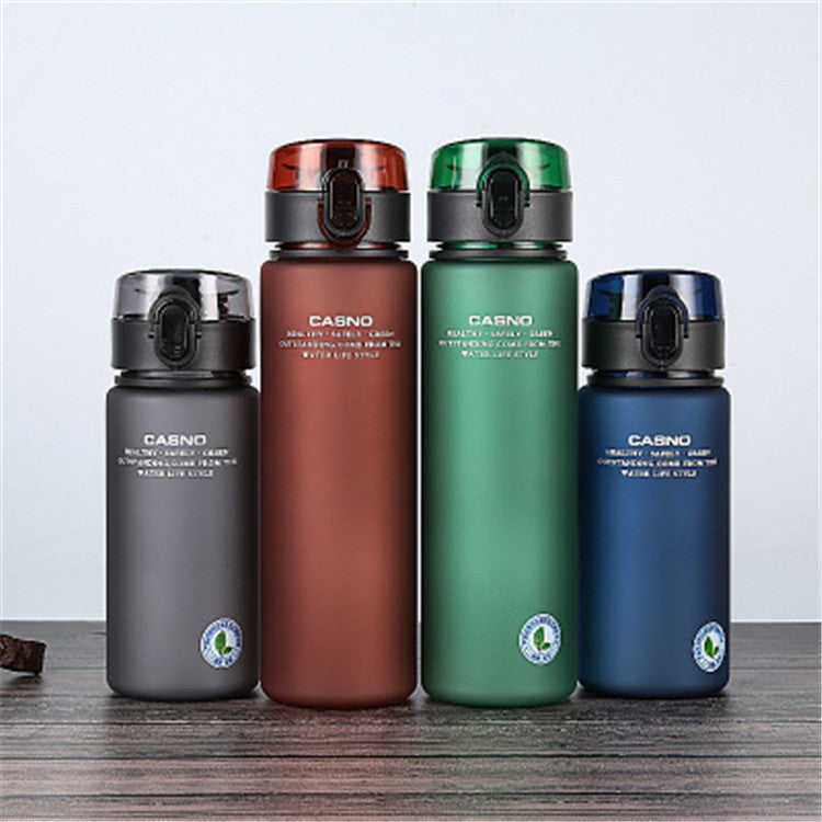 Four colorful water bottles with 'Casno' branding on a wooden surface.