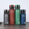 Four colorful water bottles with 'Casno' branding on a wooden surface.