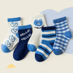 Set of blue and white children's socks with bear designs and 'HELLO!' text on a light background.