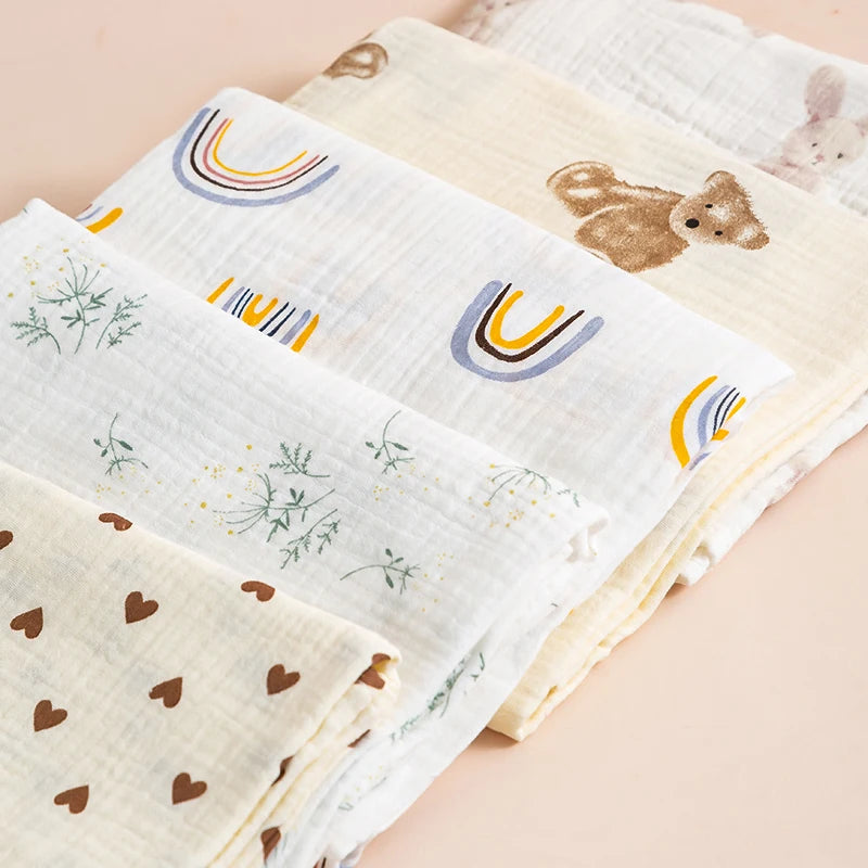 Set of baby blankets with various patterns on a beige background