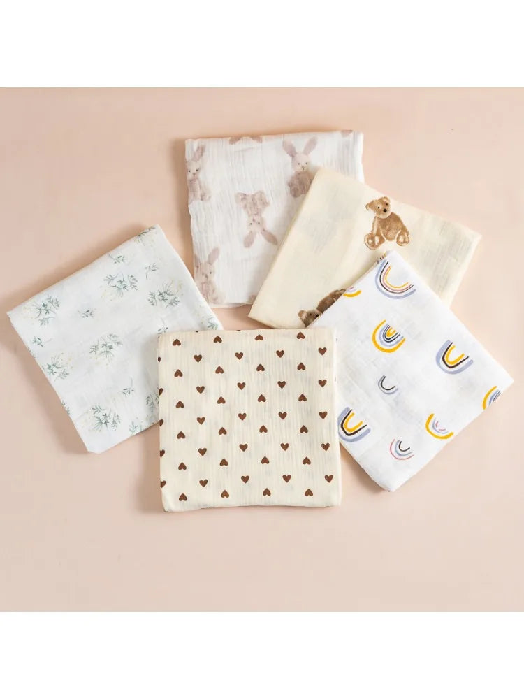 Set of five fabric swatches with different patterns on a beige background