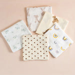 Set of five fabric swatches with different patterns on a beige background